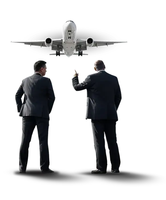 Two executives discussing with an approaching airliner